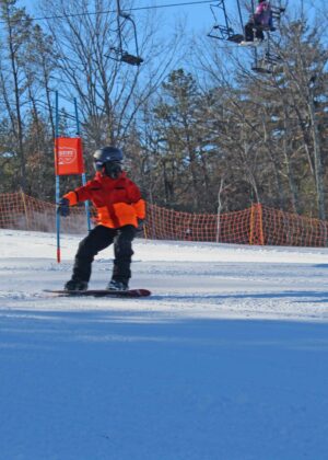 snowboard racer orange coat